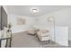 Upstairs loft area with plush carpeting, cozy seating, and ample natural light at 2309 Bulwarks Ct # 4P, Albemarle, NC 28001
