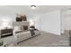 Spacious main bedroom with plush carpeting, neutral walls, a queen bed, and decorative bedside tables at 2309 Bulwarks Ct # 4P, Albemarle, NC 28001
