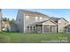 Exterior view of a gray two-story house featuring a screened porch, a lawn, and modern design at 2309 Bulwarks Ct # 4P, Albemarle, NC 28001