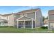 Back of a two-story gray home with a screened-in porch, offering a blend of indoor and outdoor living at 2309 Bulwarks Ct # 4P, Albemarle, NC 28001