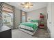 Comfortable bedroom with a queen-size bed, neutral tones, and ample natural light from large windows at 2322 Morrison Rd, York, SC 29745