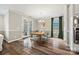 Bright dining room with hardwood floors, chandelier, and glass doors to the porch at 2322 Morrison Rd, York, SC 29745