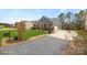 Charming home with a brick and gray siding exterior, well-manicured lawn, and a paved driveway at 2322 Morrison Rd, York, SC 29745