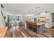 Open-concept kitchen flowing into living area, featuring a spacious island with seating and hardwood floors at 2322 Morrison Rd, York, SC 29745