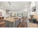 Bright kitchen with granite countertops, stainless steel appliances, and an island overlooking the living area at 2322 Morrison Rd, York, SC 29745