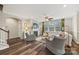 Cozy living room with a fireplace, large windows, and hardwood floors at 2322 Morrison Rd, York, SC 29745