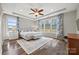 Spacious main bedroom with tray ceiling, hardwood floors, and large windows at 2322 Morrison Rd, York, SC 29745