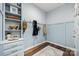 Charming mudroom features blue walls, built-in storage, and hooks for coats and bags at 2322 Morrison Rd, York, SC 29745