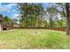 Expansive backyard with mature trees, and a patio perfect for relaxing at 2514 King Arthur Dr, Monroe, NC 28110