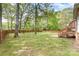 Backyard features a deck with stairs and a large stone patio perfect for entertaining at 2514 King Arthur Dr, Monroe, NC 28110