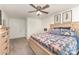 Cozy bedroom with wood bed frame and well-coordinated furnishings, ceiling fan at 2514 King Arthur Dr, Monroe, NC 28110