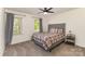 Inviting bedroom featuring a comfortable bed, soft carpeting, and ample natural light at 2514 King Arthur Dr, Monroe, NC 28110