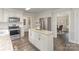 Modern kitchen featuring white cabinets, granite countertops, stainless steel appliances, and island at 2514 King Arthur Dr, Monroe, NC 28110