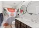 Bathroom features a double sink vanity, and shower with colorful curtain at 2739 Golden Rose Ln, Charlotte, NC 28216