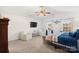 Bright bedroom with two large windows, white chairs and TV at 2739 Golden Rose Ln, Charlotte, NC 28216