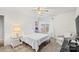 Bright, airy bedroom featuring neutral paint and carpet, and a ceiling fan at 2739 Golden Rose Ln, Charlotte, NC 28216
