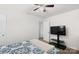 Bedroom features a ceiling fan and entertainment center at 2739 Golden Rose Ln, Charlotte, NC 28216
