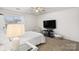 Bedroom with neutral paint and carpet, a large window, and ceiling fan at 2739 Golden Rose Ln, Charlotte, NC 28216