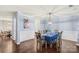 Beautiful dining room with hardwood floors, stylish lighting, and a large table at 2739 Golden Rose Ln, Charlotte, NC 28216