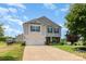 Lovely two-story home with a two-car garage, green lawn, and inviting curb appeal at 2739 Golden Rose Ln, Charlotte, NC 28216