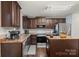 Kitchen features wooden cabinets, an island, and stainless steel appliances at 2739 Golden Rose Ln, Charlotte, NC 28216
