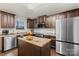 Spacious kitchen features stainless steel appliances, lots of cabinets, and an island at 2739 Golden Rose Ln, Charlotte, NC 28216