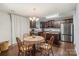 Eat-in kitchen boasts hardwood floors, wooden cabinets, and stainless steel appliances at 2739 Golden Rose Ln, Charlotte, NC 28216