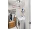 Well-organized laundry room with washer, dryer, and storage space at 2739 Golden Rose Ln, Charlotte, NC 28216