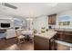 Open-concept living area boasts a fireplace, hardwood floors, and a lovely eat-in kitchen at 2739 Golden Rose Ln, Charlotte, NC 28216