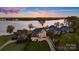 Stunning waterfront home with lush lawn, private dock, and picturesque sunset views at 356 Yacht Rd, Mooresville, NC 28117