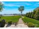 Beautiful landscaped backyard with stone path and lake view, perfect for enjoying nature at 356 Yacht Rd, Mooresville, NC 28117