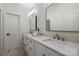 Modern bathroom featuring double sinks with marble countertops, sleek fixtures, and contemporary lighting at 356 Yacht Rd, Mooresville, NC 28117