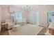 Charming Bedroom featuring bow-themed wallpaper, a white crib, and a cozy armchair with ottoman at 356 Yacht Rd, Mooresville, NC 28117