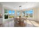 Bright dining area with water views, a round table, and contemporary chandelier at 356 Yacht Rd, Mooresville, NC 28117