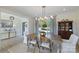 Traditional dining room featuring a wooden table, decorative lighting, and a large window with outdoor views at 356 Yacht Rd, Mooresville, NC 28117