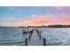 Private boat dock on the water with a boat, perfect for lake access at 356 Yacht Rd, Mooresville, NC 28117