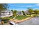 Stunning lakefront property with lush green lawn, pier, and beautiful landscaping at 356 Yacht Rd, Mooresville, NC 28117