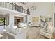 Expansive living room featuring high ceilings, an overlook, and an open layout to the dining area at 356 Yacht Rd, Mooresville, NC 28117