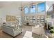 Grand living room showcasing high ceilings, large windows with water views, and elegant decor at 356 Yacht Rd, Mooresville, NC 28117
