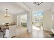 Bright open-concept living room featuring a formal dining area, hardwood floors, and sun-filled view at 356 Yacht Rd, Mooresville, NC 28117