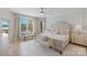 Airy main bedroom featuring a large window, sitting area, neutral color palette, and patterned accent wall at 356 Yacht Rd, Mooresville, NC 28117
