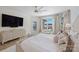 Light filled main bedroom with a waterfront view, decorative throw pillows, and calming color palette at 356 Yacht Rd, Mooresville, NC 28117