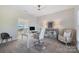 Bright office with a desk, comfortable seating, neutral color palette, and view of the water at 356 Yacht Rd, Mooresville, NC 28117