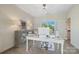 Well-lit office space with a modern desk, ample storage, neutral color palette, and view of the yard at 356 Yacht Rd, Mooresville, NC 28117