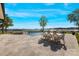 Spacious patio with outdoor dining set and lake view, perfect for entertaining at 356 Yacht Rd, Mooresville, NC 28117