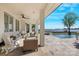 Relaxing patio with outdoor seating, ceiling fan, and a stunning view of the water and pool at 356 Yacht Rd, Mooresville, NC 28117