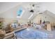 Spacious playroom with skylights, comfortable seating, and a variety of toys for creative play at 356 Yacht Rd, Mooresville, NC 28117