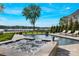 Resort-style pool area with hot tub, comfortable lounge chairs, and picturesque waterfront views at 356 Yacht Rd, Mooresville, NC 28117