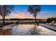 Beautiful waterfront pool with relaxing lounge chairs and stunning sunset views at 356 Yacht Rd, Mooresville, NC 28117