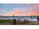 Relaxing Adirondack chairs and fire pit by the water's edge at 356 Yacht Rd, Mooresville, NC 28117